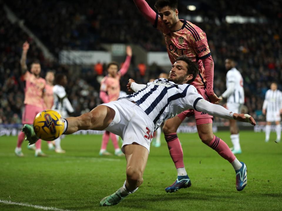 Okay Yokuslu stretches to reach the ball against Leeds