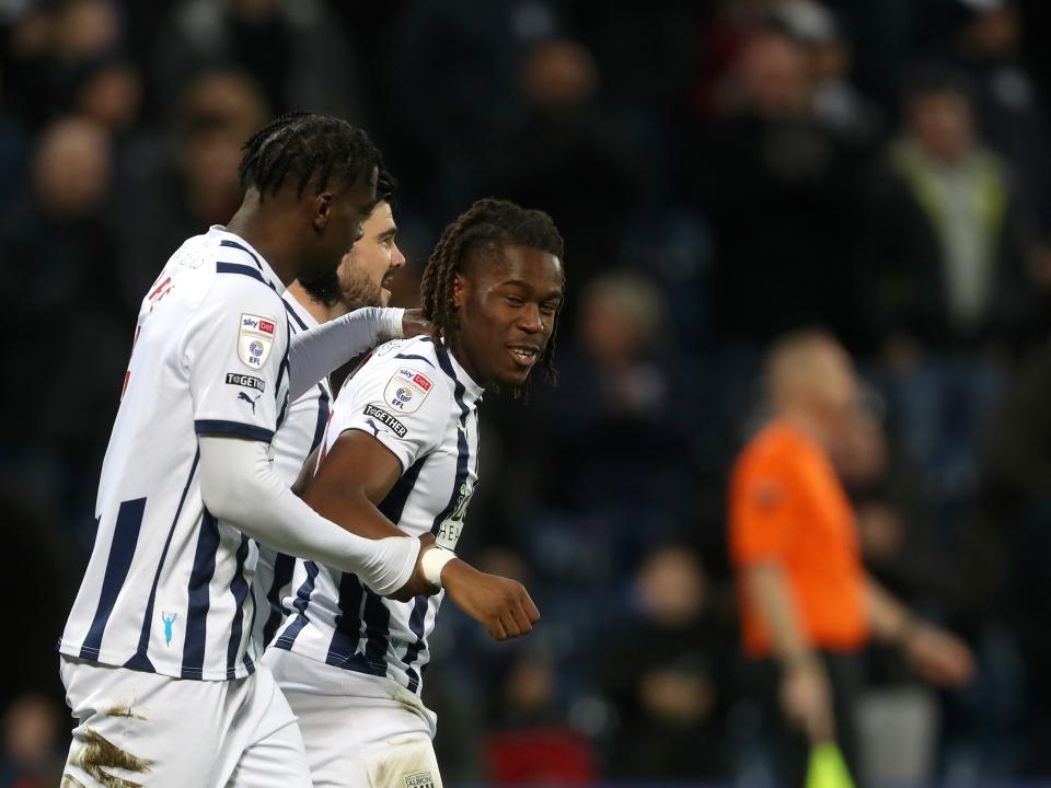 Brandon Thomas-Asante celebrates scoring against Norwich with Cedric Kipre