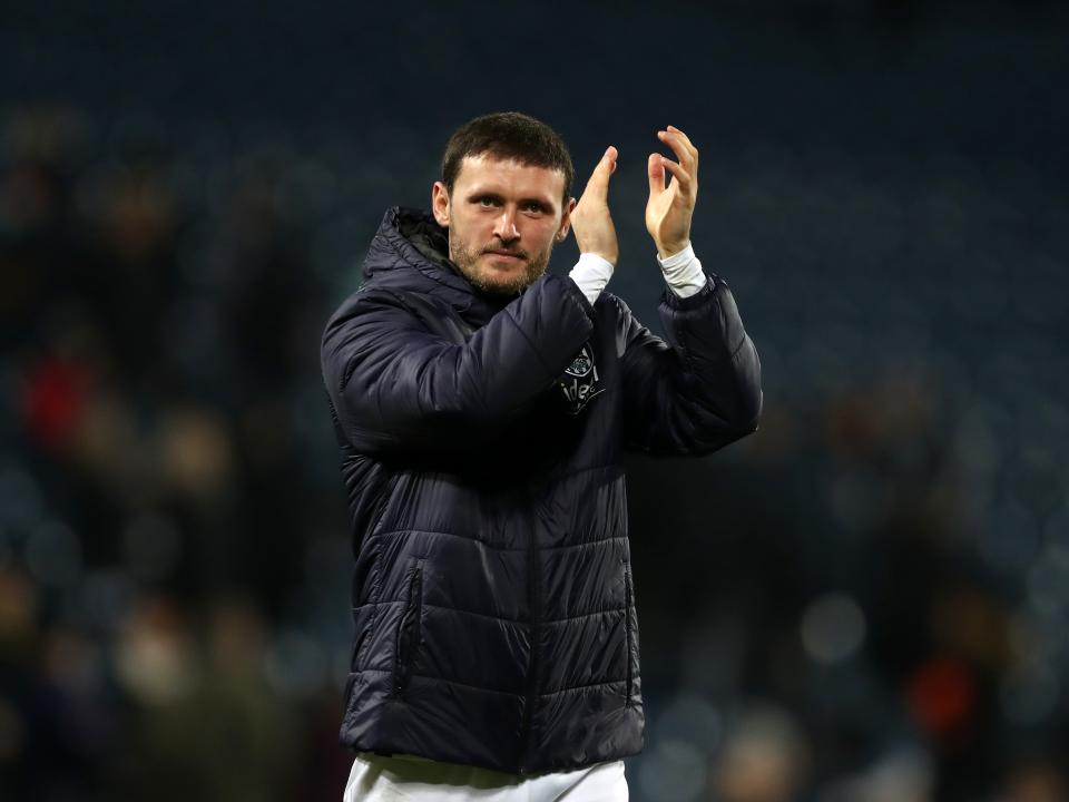 John Swift applauds supporters at full-time against Norwich
