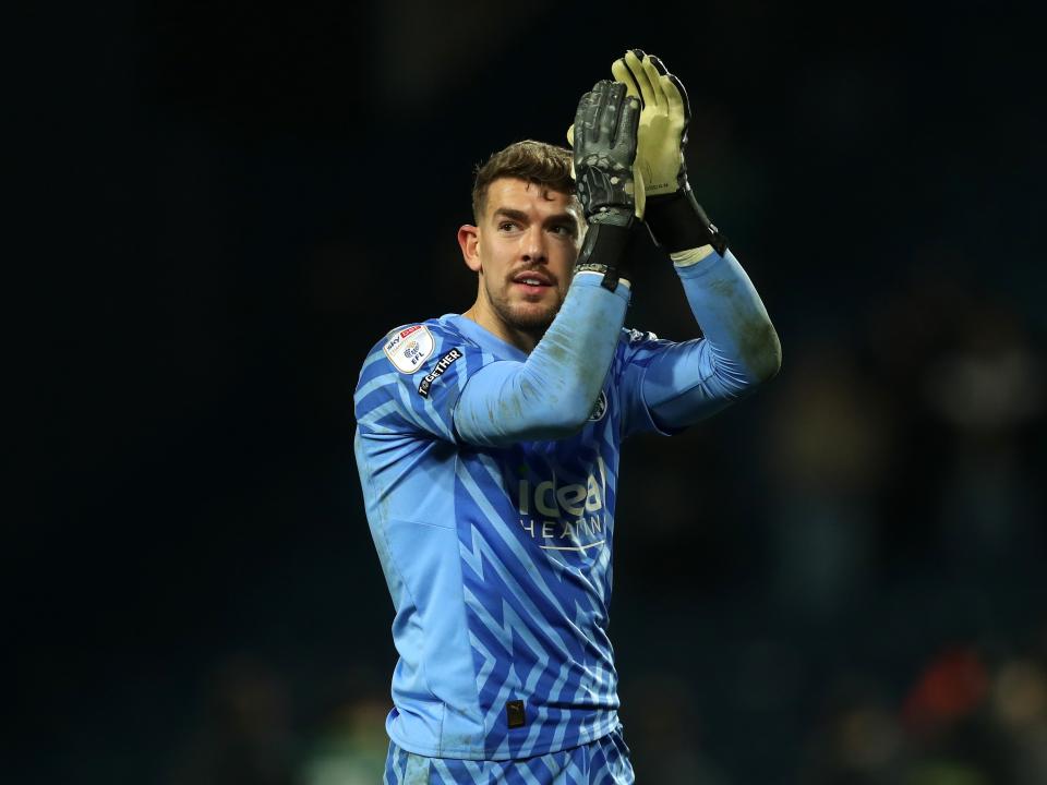 Alex Palmer applauds supporters at full-time against Norwich