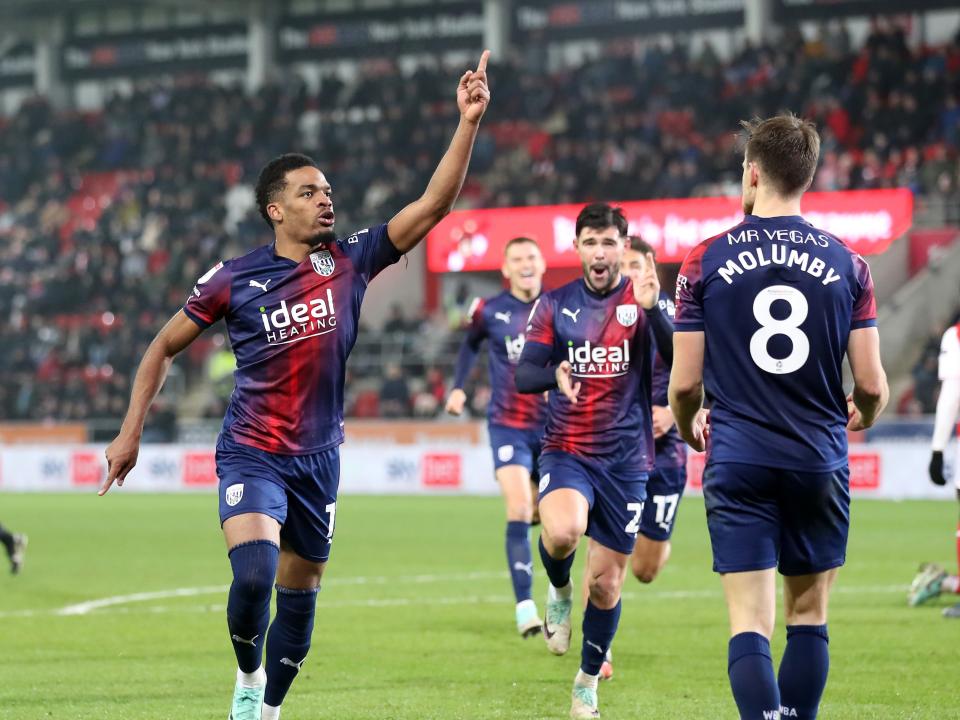 Grady Diangana runs towards the away end to celebrate scoring at Rotherham United