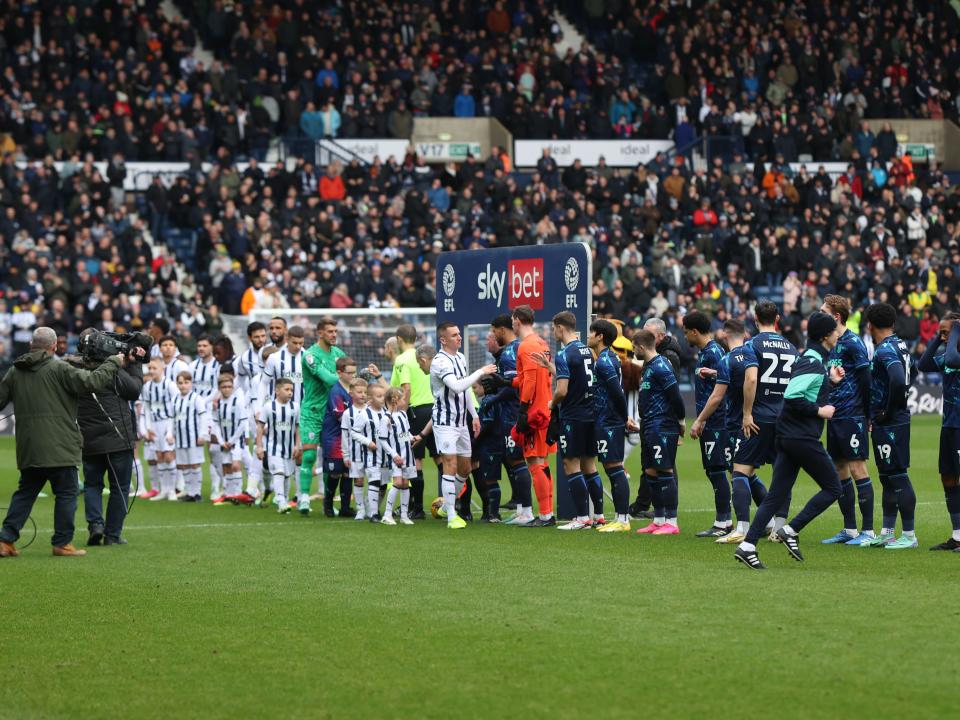 Albion players and Stoke players lining up before the game