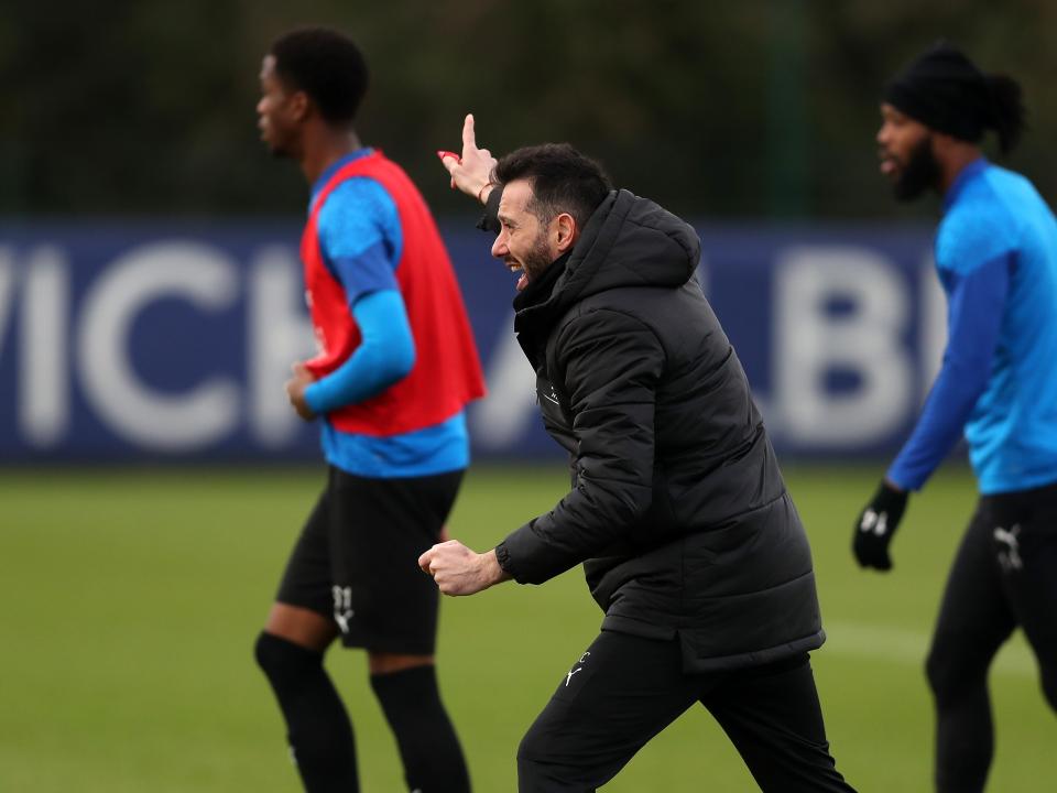Carlos Corberán watching training 