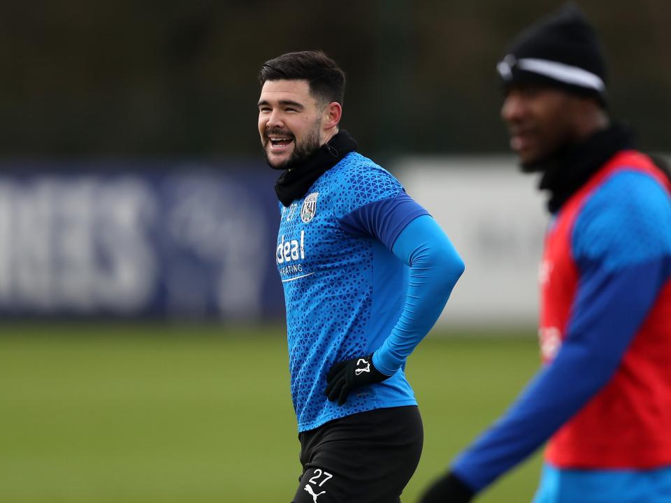 Alex Mowatt smiling during training