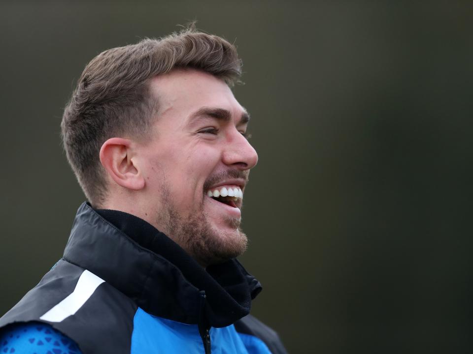 Alex Palmer smiling during training 