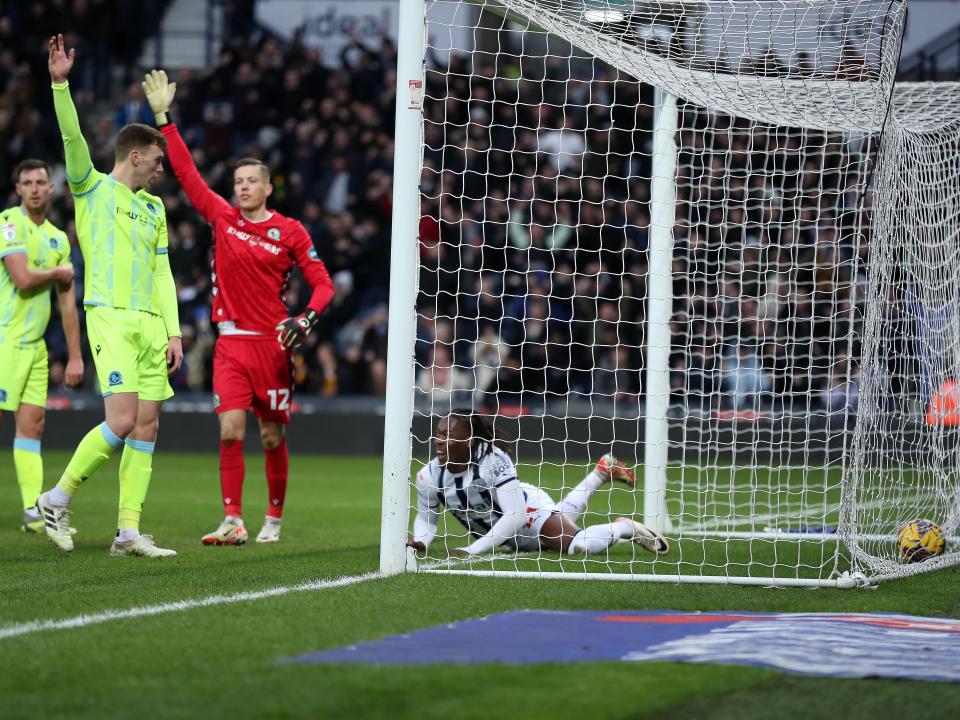Brandon Thomas-Asante stretches for the ball on the goaline 
