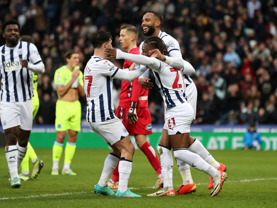 Alex Mowatt, Brandon Thomas-Asante and Kyle Bartley celebrate Albion's third goal against Blackburn