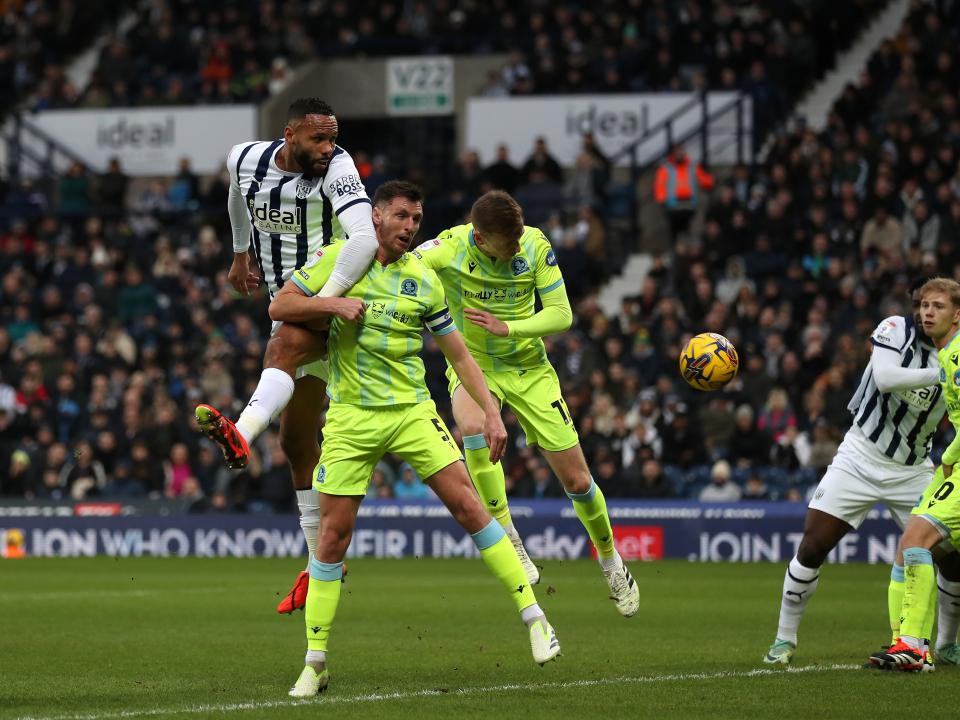 Kyle Bartley jumps for the ball against Blackburn 