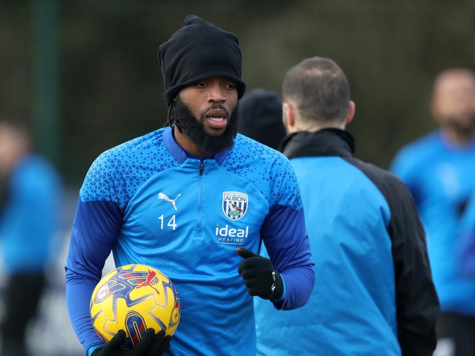 Nathanial Chalobah in training holding a yellow ball