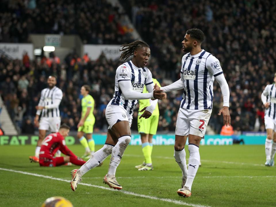 Brandon Thomas-Asante celebrates scoring his second against Blackburn with Darnell Furlong