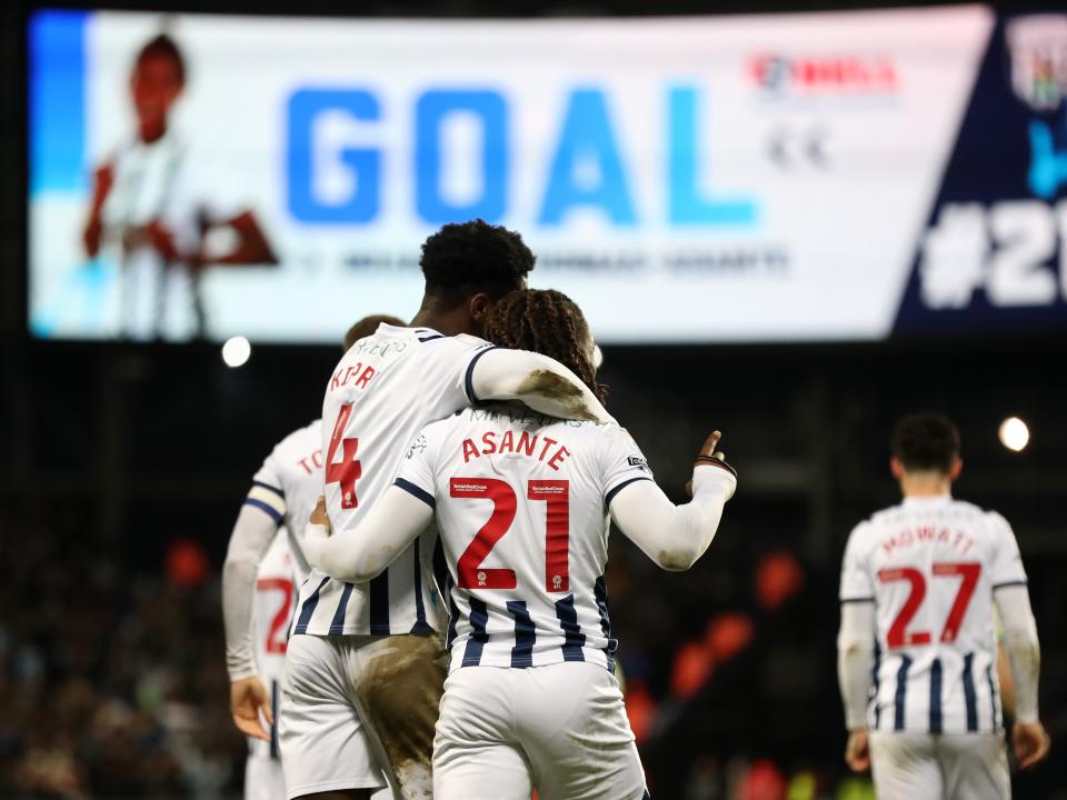 Brandon Thomas-Asante celebrates scoring his second against Blackburn with Cedric Kipre