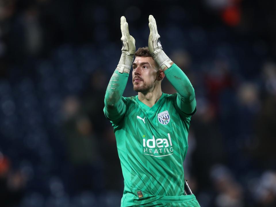 Alex Palmer applauds supporters after full time against Blackburn