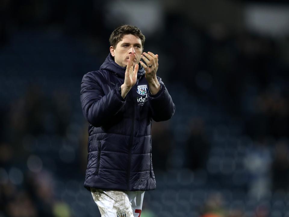 Adam Reach applauds supporters after full time against Blackburn
