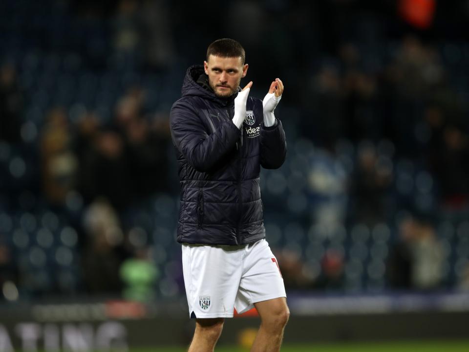 John Swift applauds supporters after full time against Blackburn