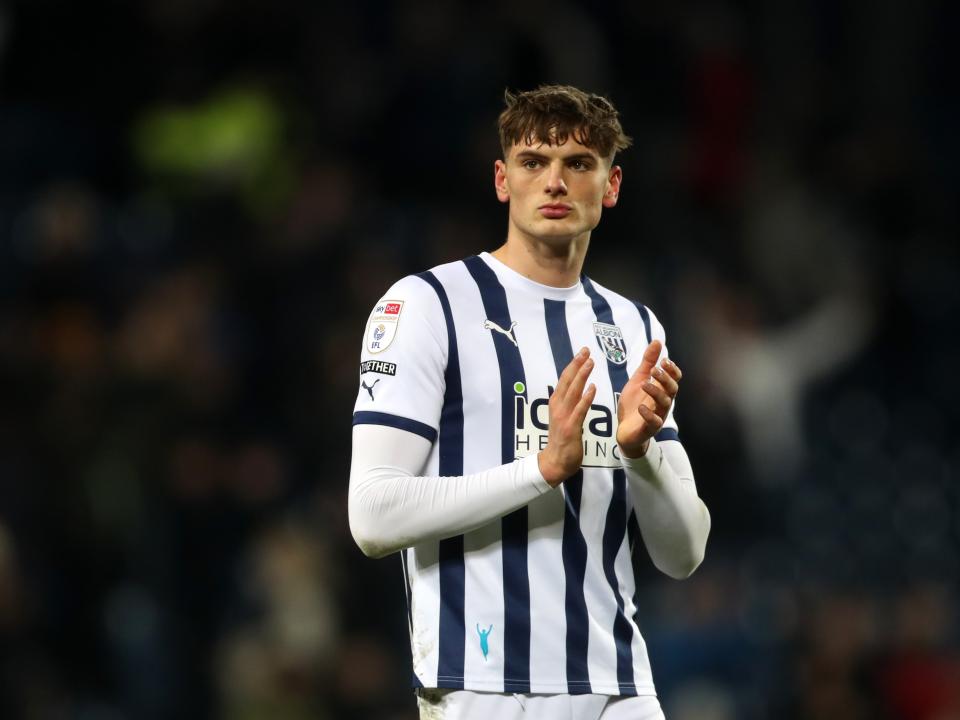 Caleb Taylor applauds supporters after full time against Blackburn