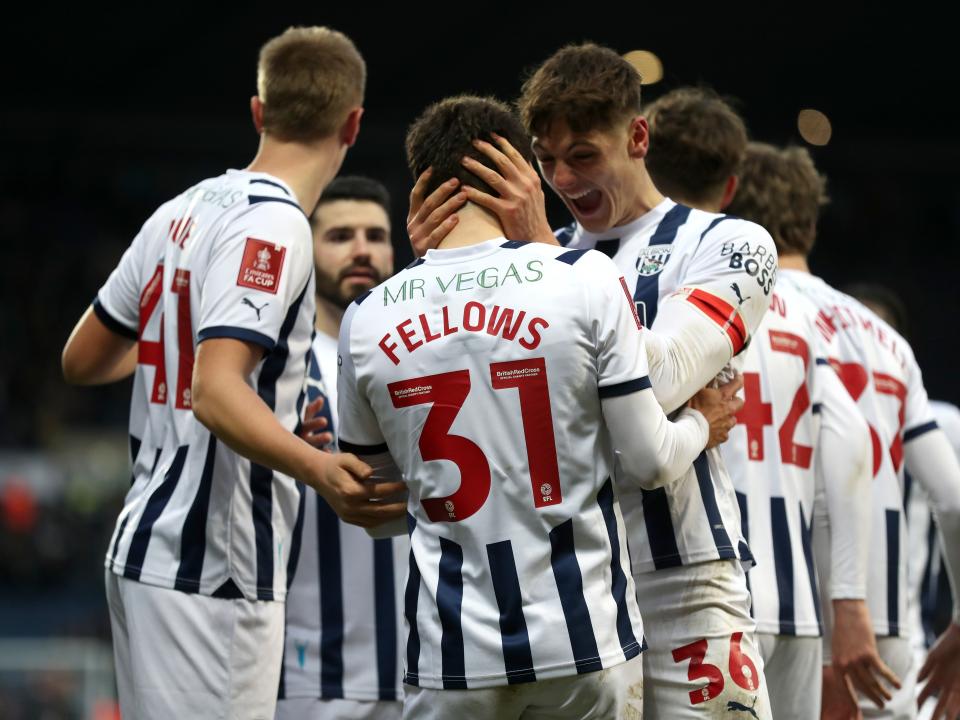 Tom Fellows celebrates scoring against Aldershot with team-mates