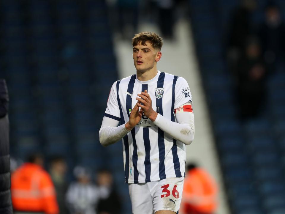 Caleb Taylor applauds supporters after the Aldershot game