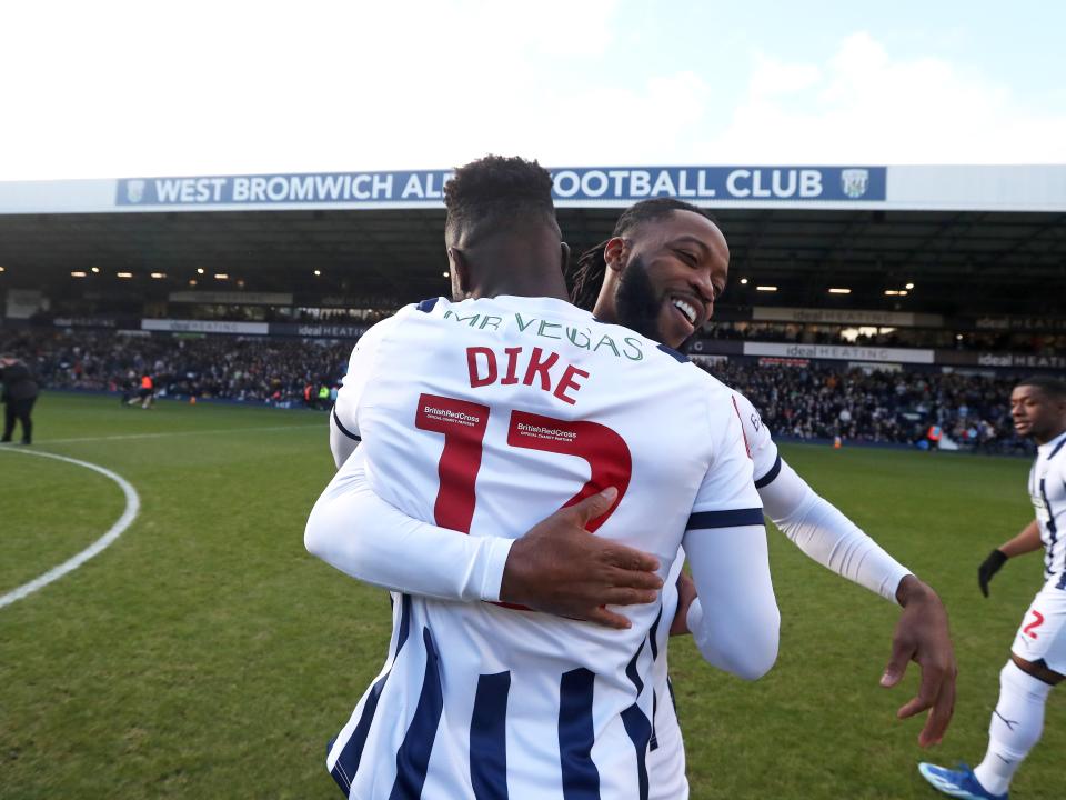Daryl Dike hugs Nathaniel Chalobah before the Aldershot game