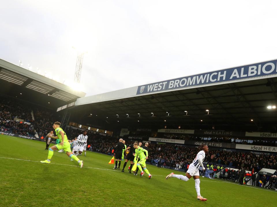 Albion players and Blackburn players break away from the line up before kick-off at The Hawthorns