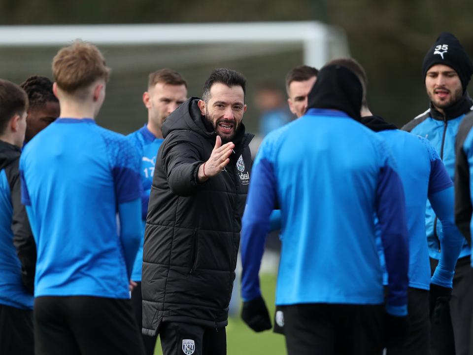 Carlos Corberan delivers info to his squad during training