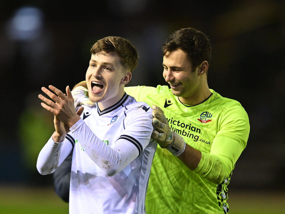 A photo of Zac Ashworth applauding Bolton fans after helping his loan team to a win at Carlisle