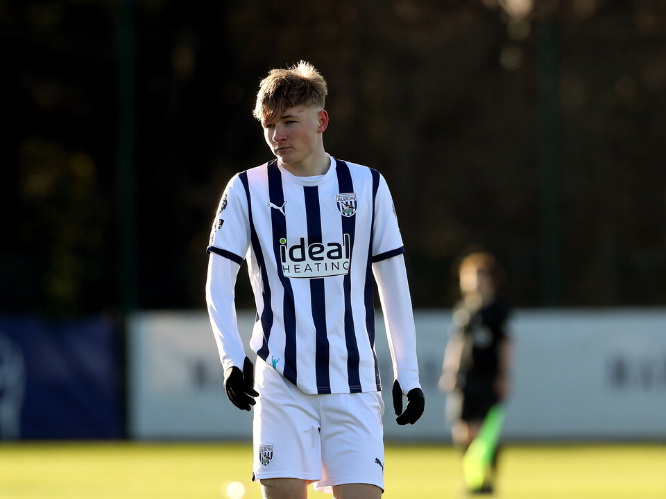 A photo of Albion U18s midfielder Ollie Bostock, wearing the 2023/24 home kit, in action at the club's training ground
