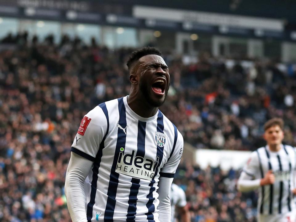 Daryl Dike celebrates scoring a goal against Aldershot