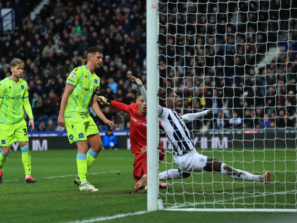 Brandon Thomas-Asante stretches for the ball on the goaline 
