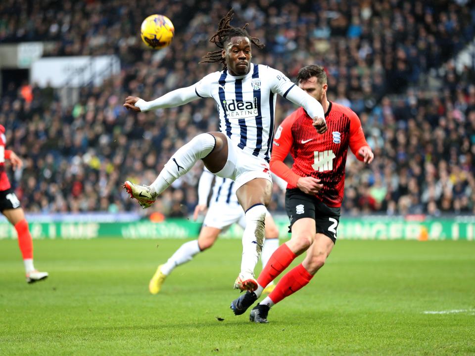 Brandon Thomas-Asante jostling for the ball against Blues