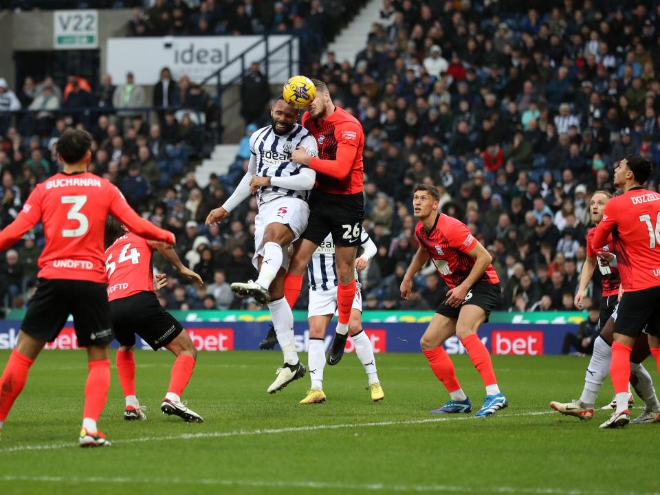 Kyle Bartley heading the ball against Blues