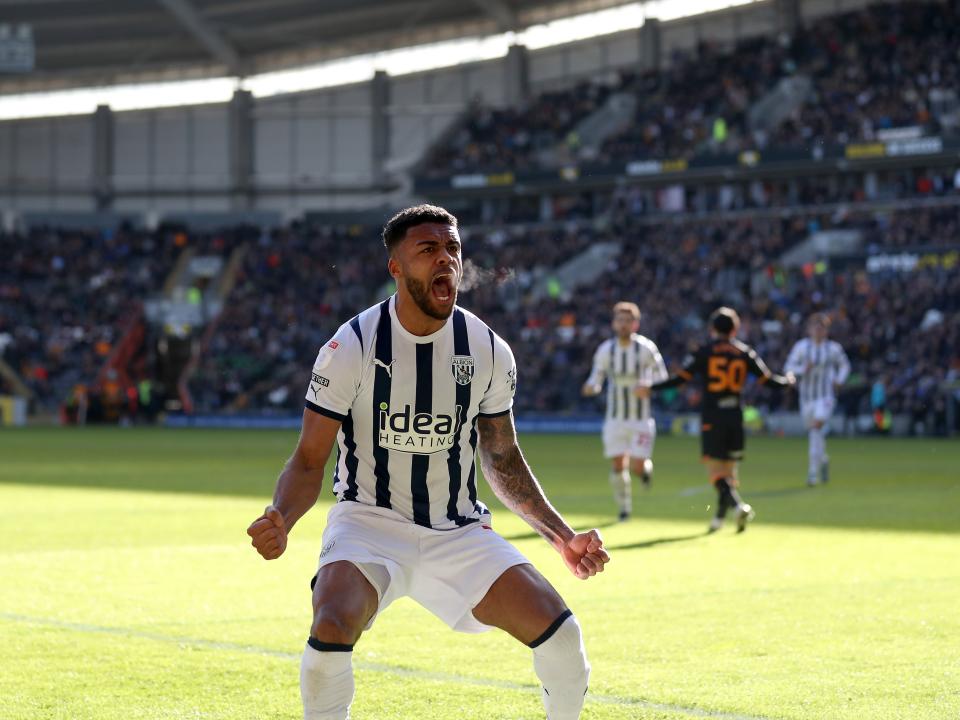 Darnell Furlong celebrates his goal against Hull in front of the Albion fans