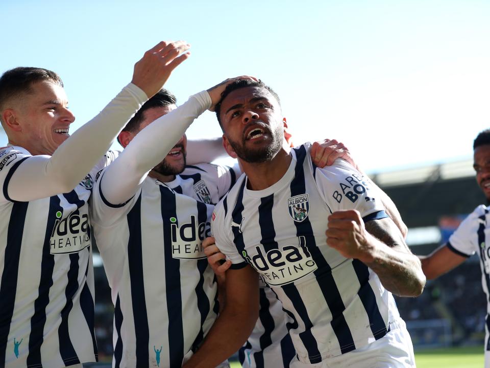 Darnell Furlong celebrates scoring against Hull with Conor Townsend and Alex Mowatt
