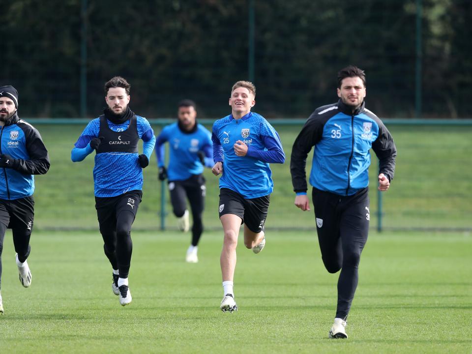 Pipa, Mikey Johnston, Callum Marshall and Okay Yokuslu running towards the camera during a training session