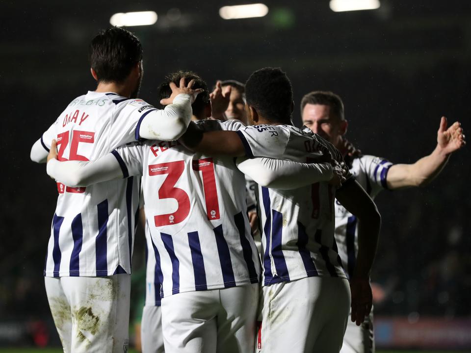 Tom Fellows celebrates scoring against Plymouth with several team-mates