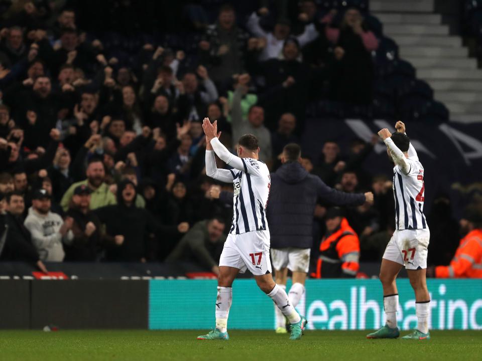 Andi Weimann and Alex Mowatt celebrate the win over Blues with supporters