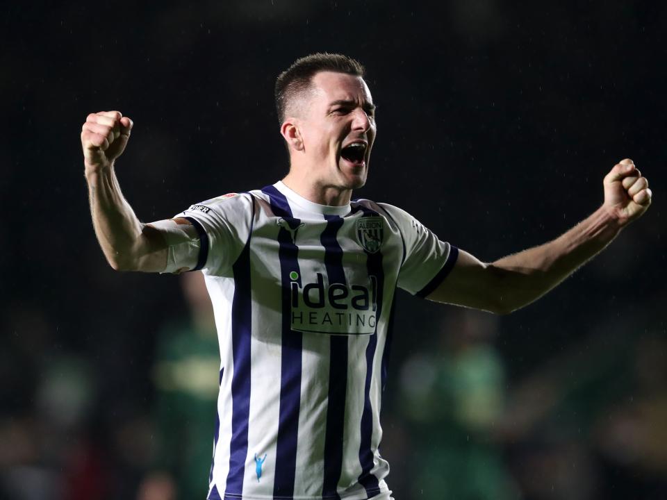 Jed Wallace celebrates with Albion fans after the full-time whistle at Plymouth