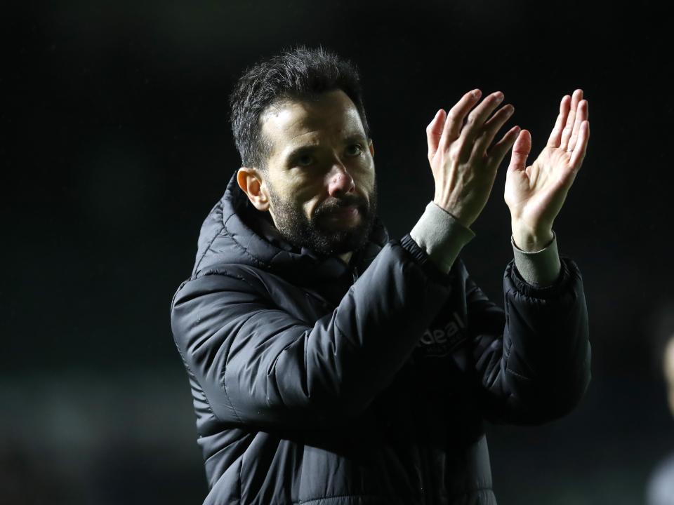 Carlos Corberán applauds Albion fans after the full-time whistle at Plymouth