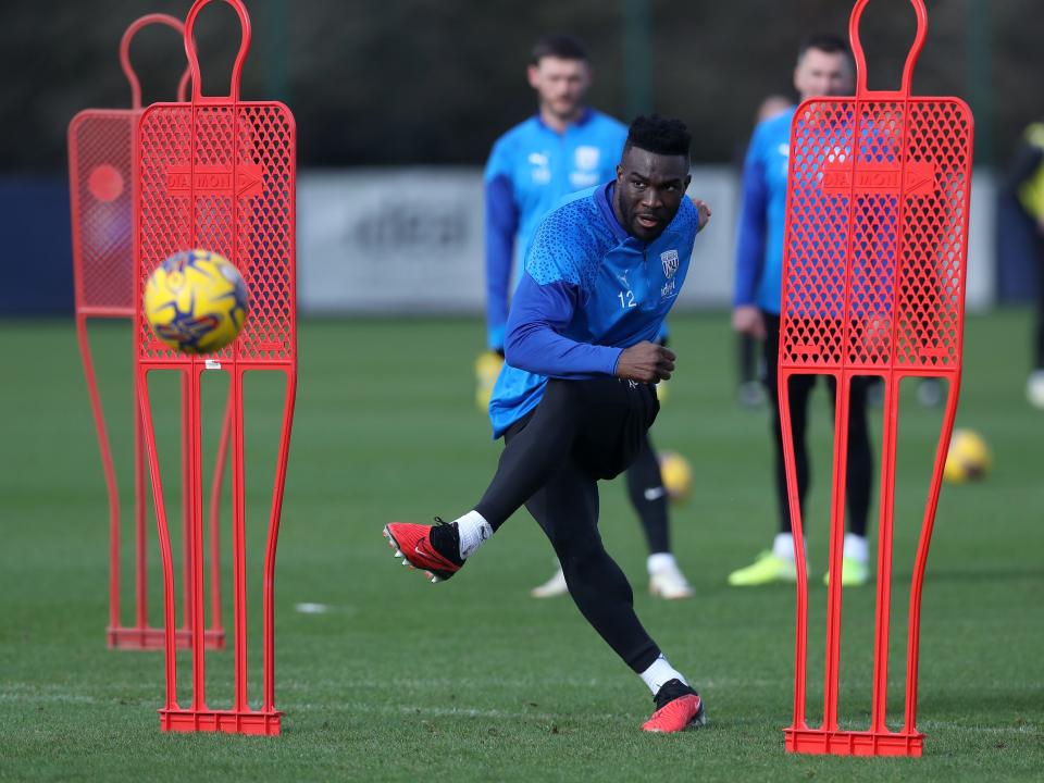 Daryl Dike shoots at goal during a training session