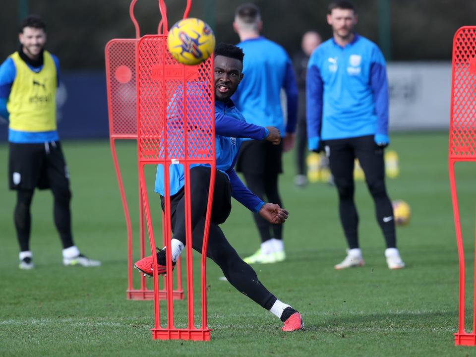 Daryl Dike shoots at goal during a training session