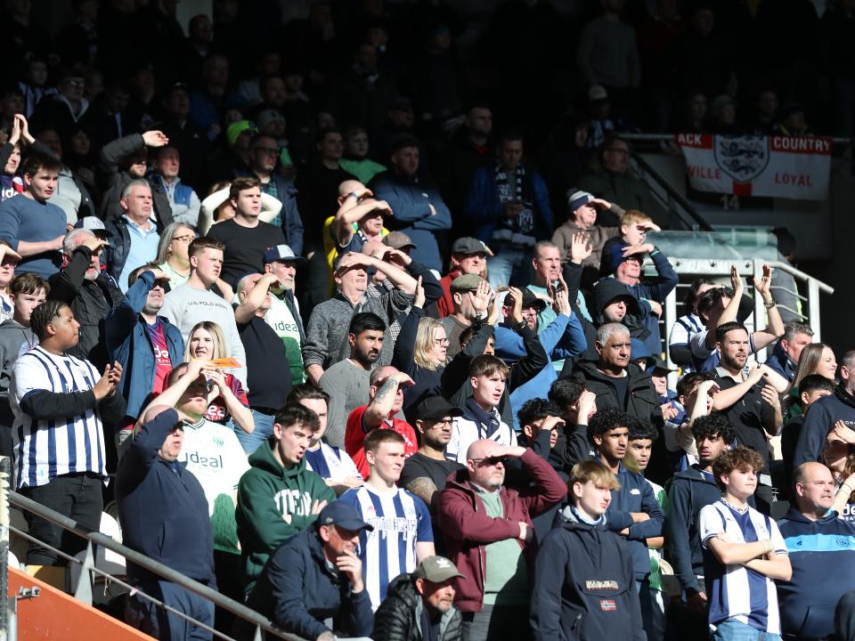 A general view of Albion fans in the away end at the MKM Stadium
