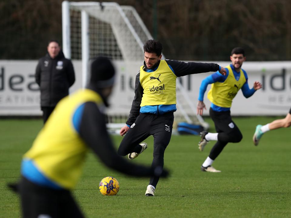 Okay Yokuslu passes the ball during training 