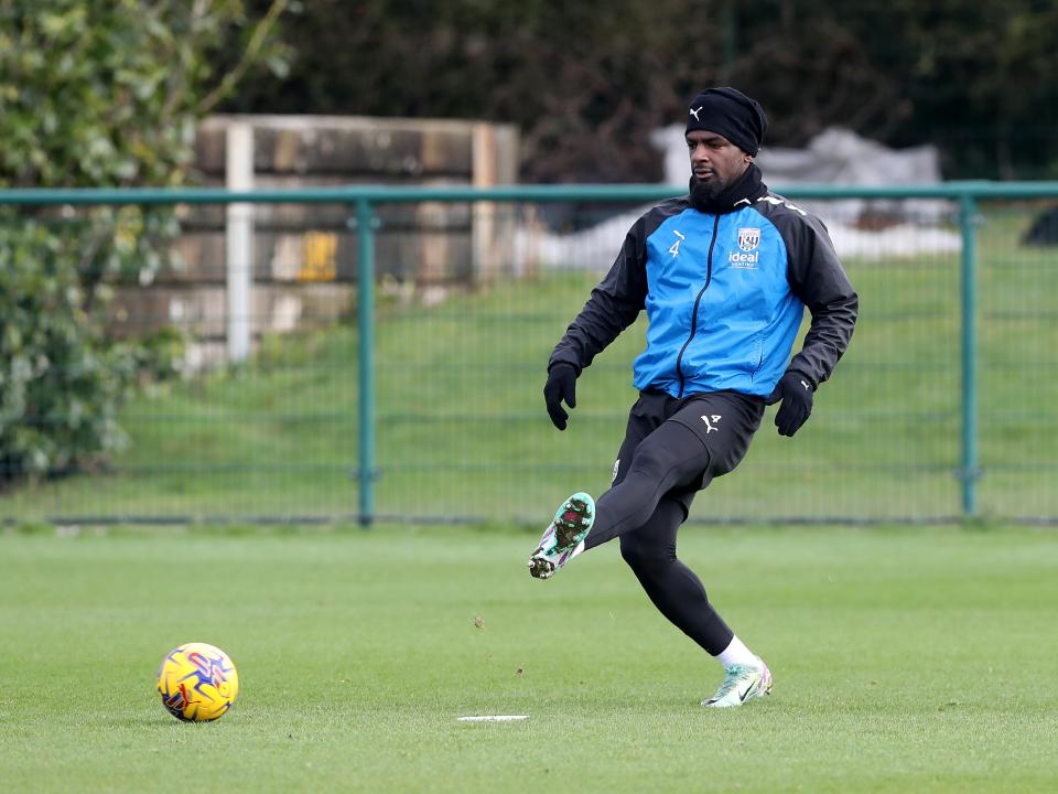 Cedric Kipre passes the ball during training 