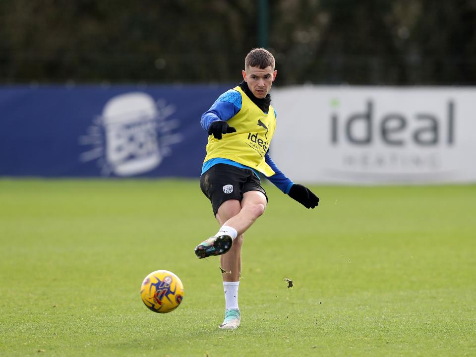 Conor Townsend passes the ball during training