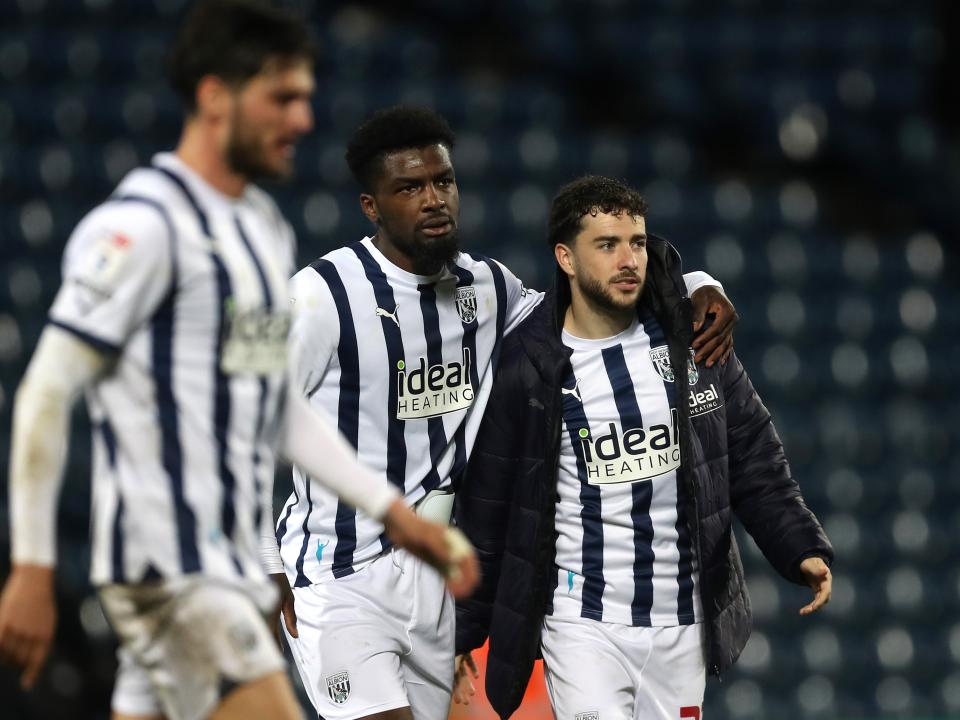 Cedric Kipre and Mikey Johnston on the pitch together after beating Cardiff