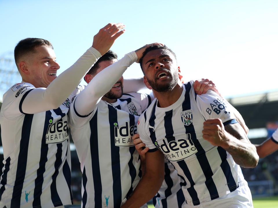 An image of Darnell Furlong celebrating a goal with his teammates