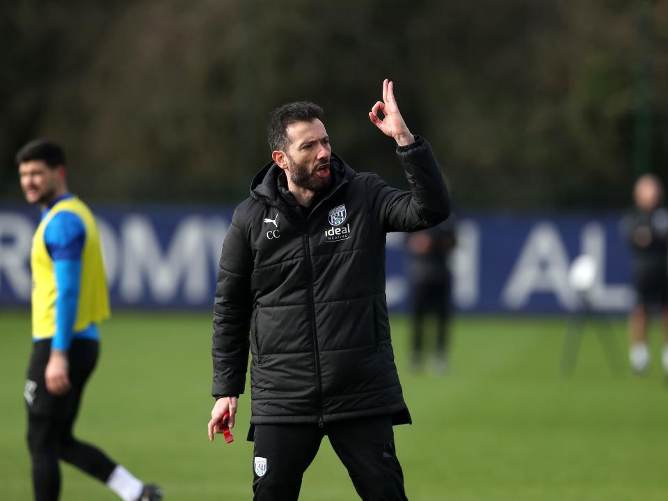 Carlos Corberán making a point to his players during a training session