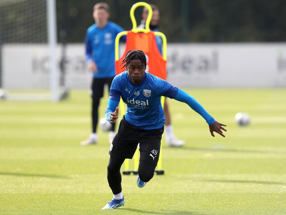 A photo of Akeel Higgins in 2023/24 blue training gear