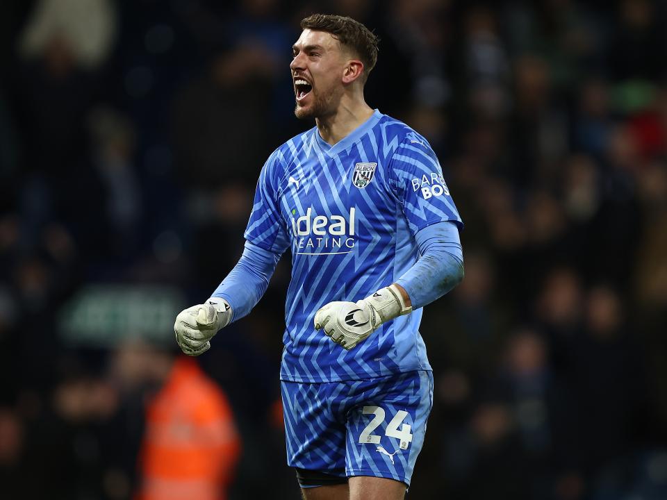 Alex Palmer celebrates victory after the final whistle