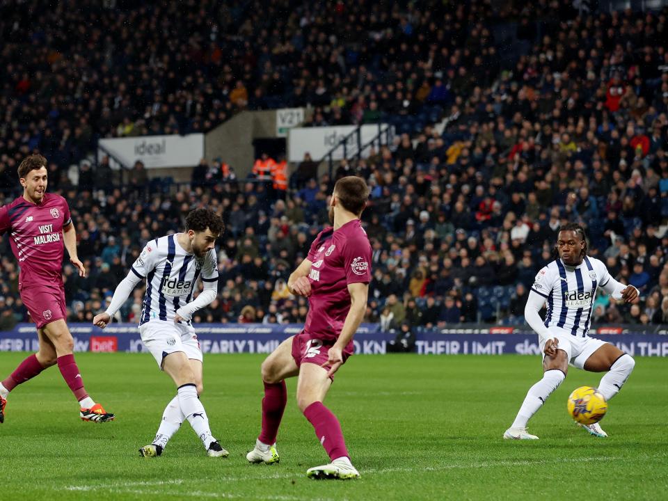 Mikey Johnston shoots and scores against Cardiff
