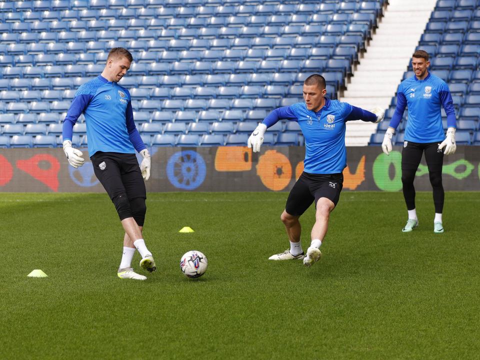 Albion goalkeepers playing a passing game on the pitch at The Hawthorns during a training session
